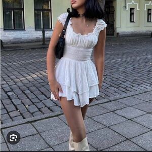 Urban outfitters Rosie smocked tiered ruffle romper in ivory
